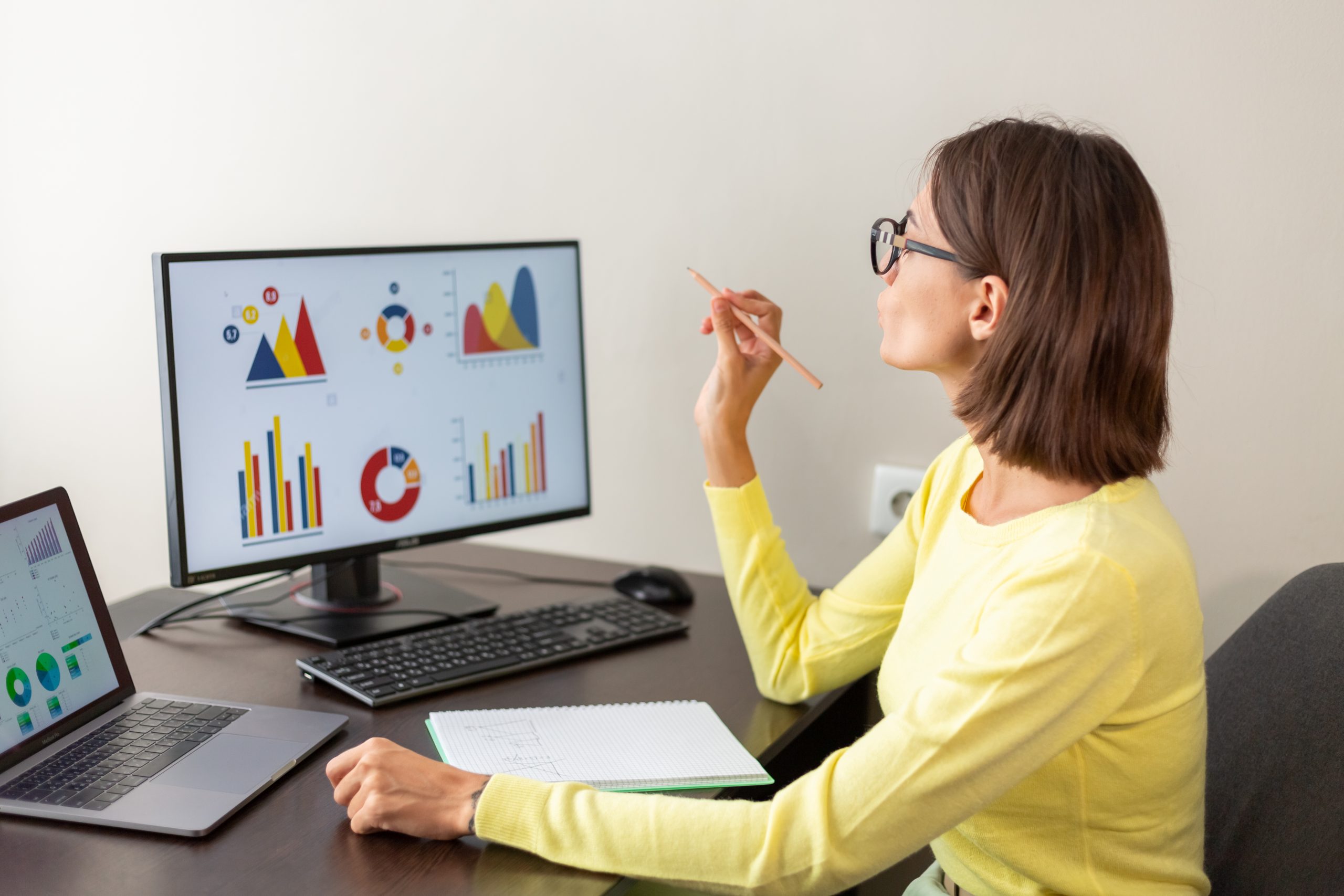 caucasian advisor financial business analytics woman with data dashboard graphs